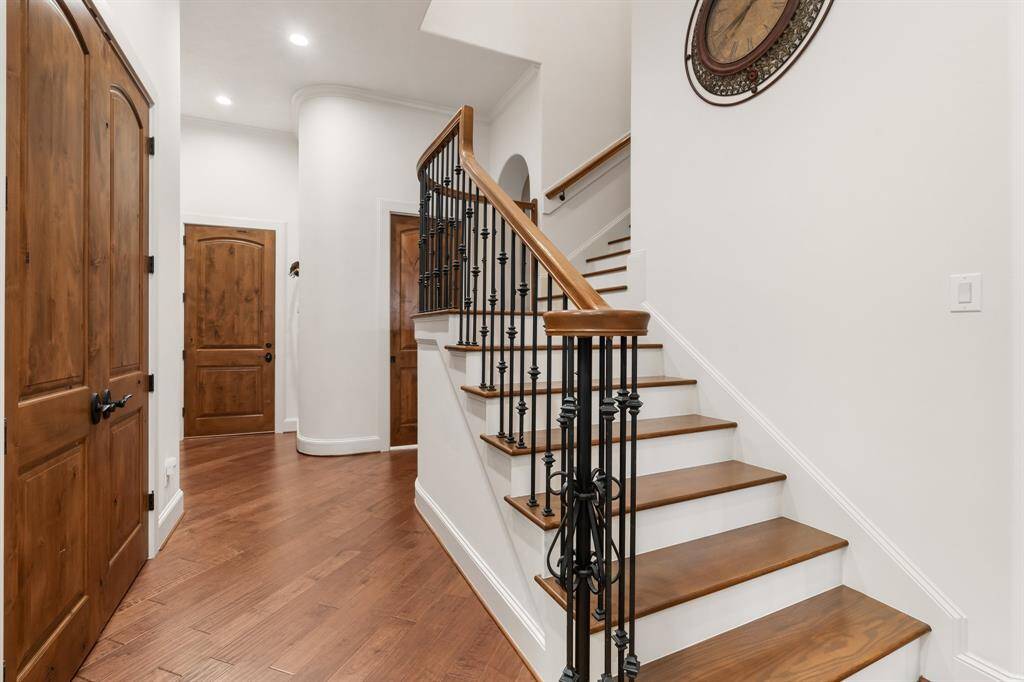 Spacious MUD area and storage; back stairs lead the way to the second floor game room.
