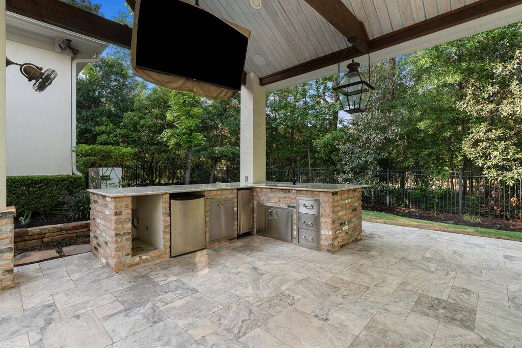 Entertain in style, this kitchen features a high end Hoshizaki ice maker, mini fridge, storage and sink. TV stays!