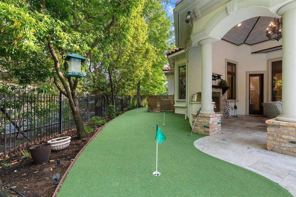 A private putting green in the backyard, perfect for relaxing or practicing your short game.