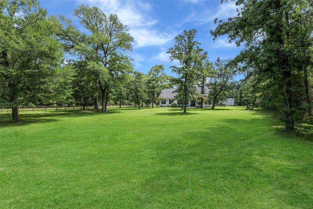This is a beautiful tree-lined property located in the Estates of Clear Creek Forest.
