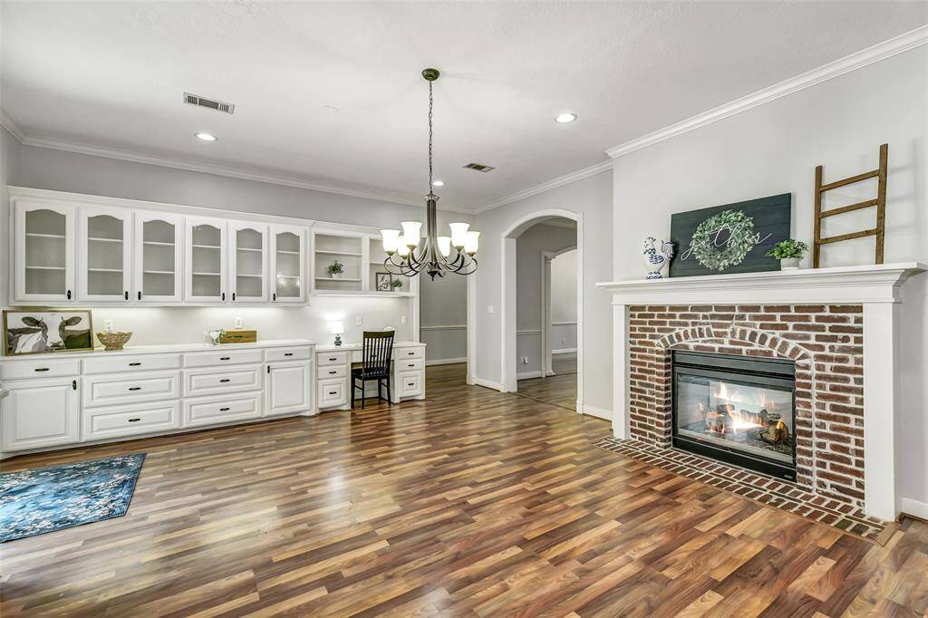 WOW! This kitchen is fantastic! High ceilings, extensive counter, drawer and cabinet storage. Double sided brick fireplace.