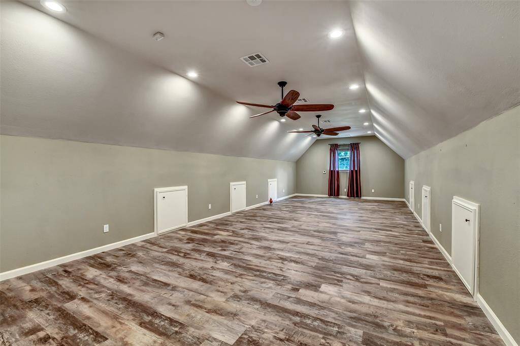 Over 550 sf Gameroom! Each of the doors shown have storage. Great for holiday storage. This room is located off of the laundry room and has private stairs. There is additional room if you want to add a full bath or need more space.