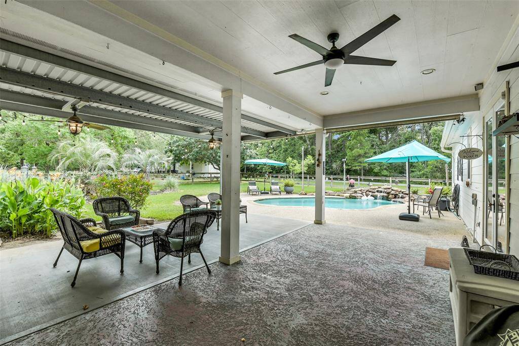 HUGE covered back patio. Has French doors to the house, and a door to the garage.