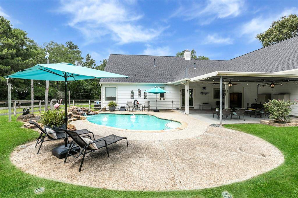 Pool and covered back porch. Tons of memories to be made here!