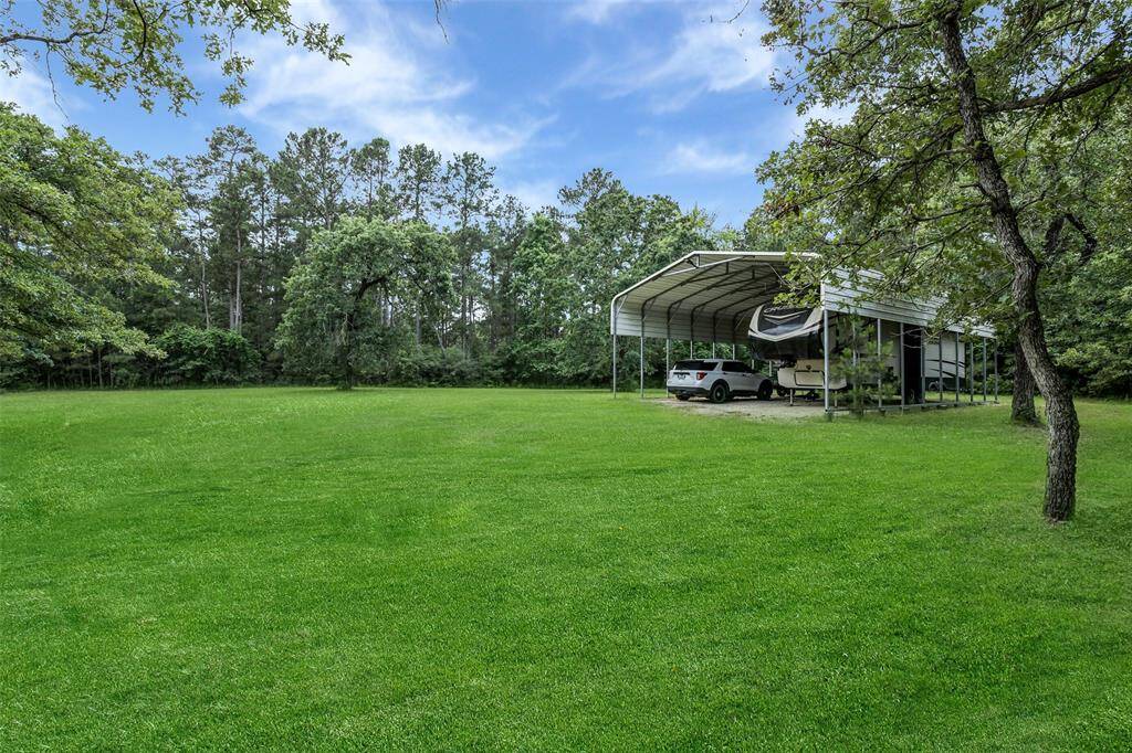 Great covered parking with room for a large RV and a boat or even a horse trailer.