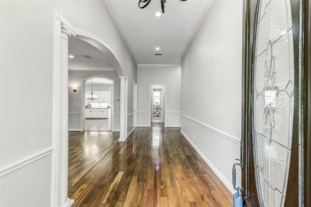 Welcome home! 2025 Interior walls painted! Large entry with high ceilings. Half bath is located at the end of this hallway.