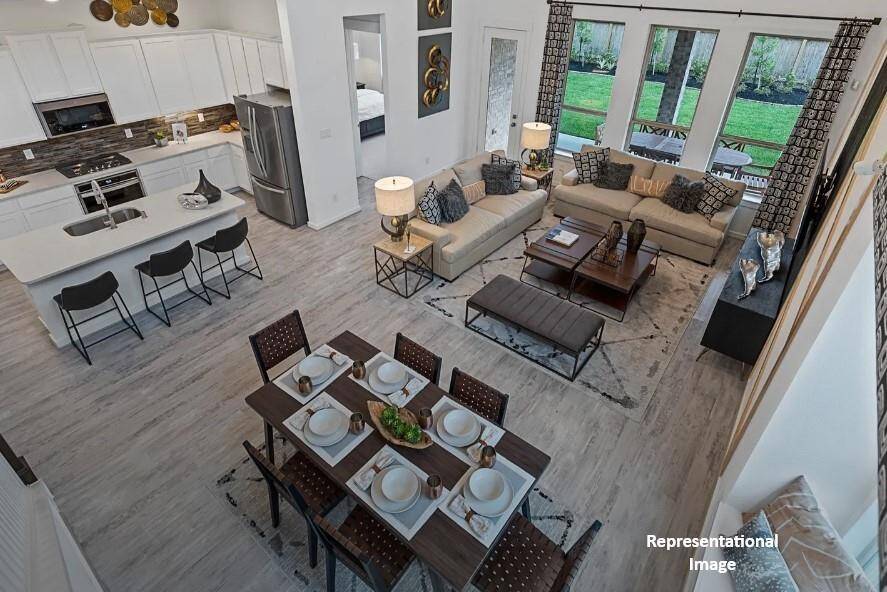 Picture expansive windows that invite natural light to dance through spacious living areas, creating a welcoming atmosphere perfect for gatherings or quiet moments of reflection.