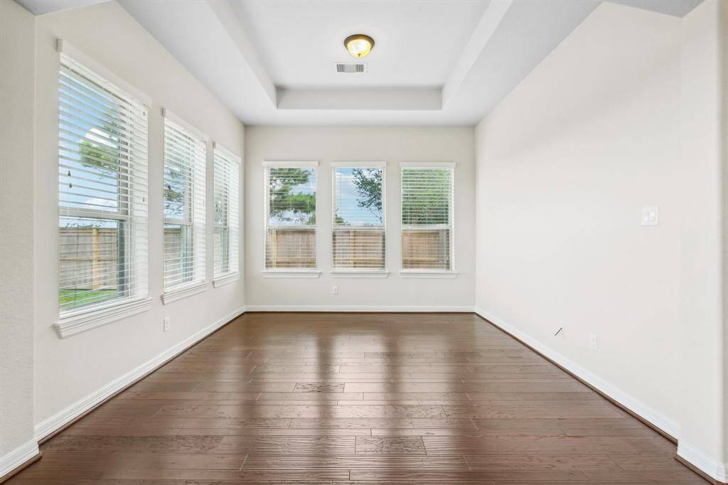 Tray ceiling and 6 lovely windows create a special room prime for inspiration.