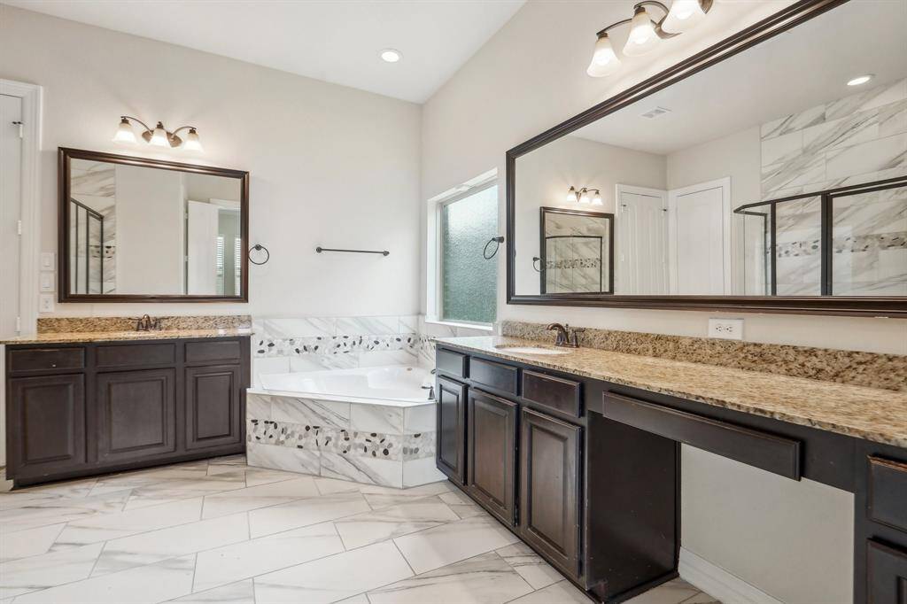 Framed mirrors and warm tones create a relaxing space.
