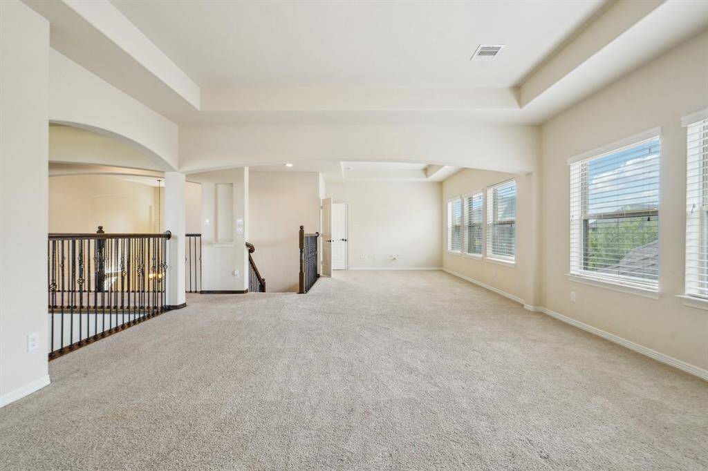 Across the expansive space is the door into the private media room.