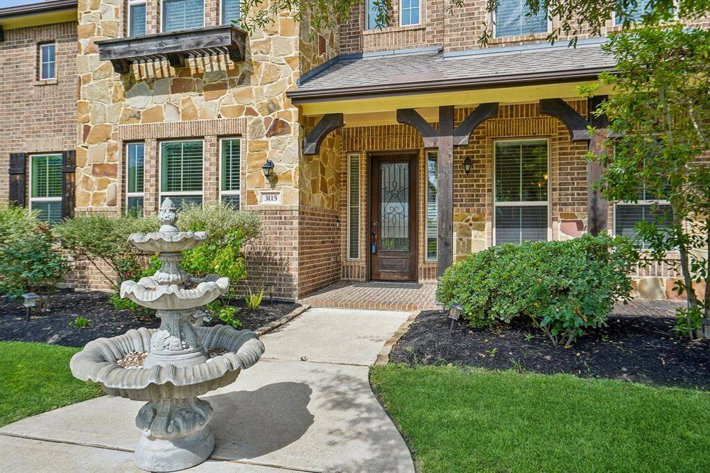 Gorgeous curb appeal beckons you inside.