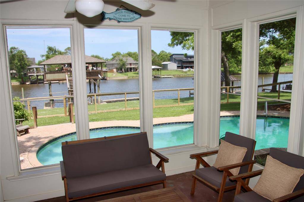 Soak in uninterrupted water and pool views from the sunroom—perfect for morning coffee or evening conversations.