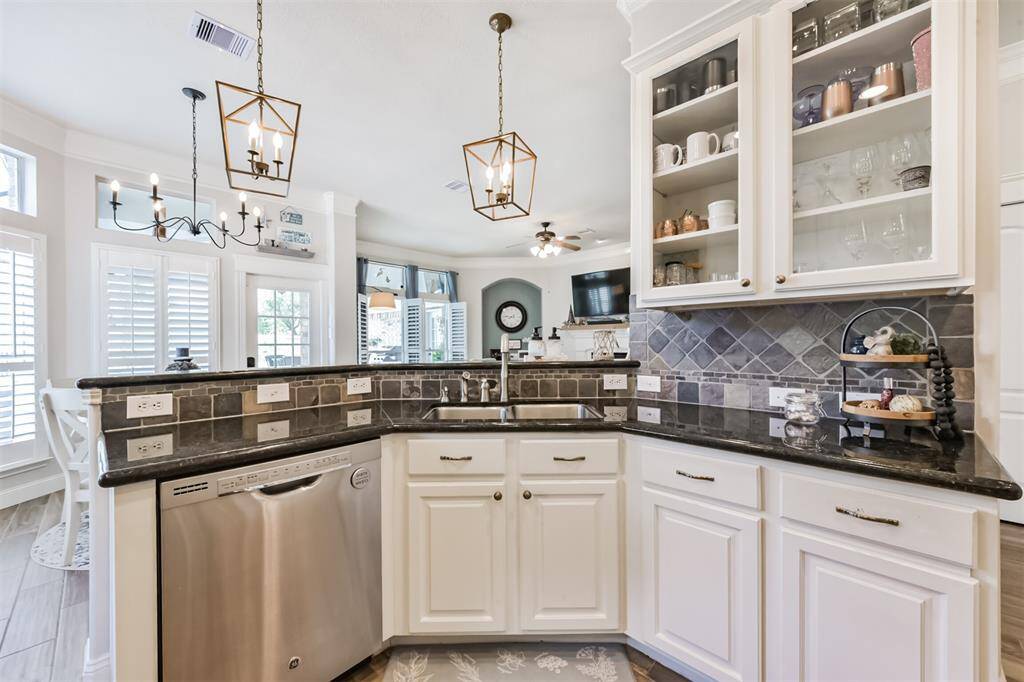 A bright and airy kitchen featuring a convenient service bar.