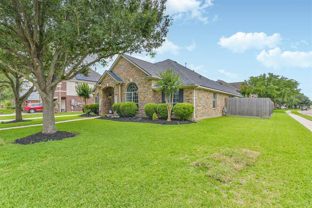 Corner-lot home nestled on a peaceful cul-de-sac street, with mature trees offering natural beauty and privacy.