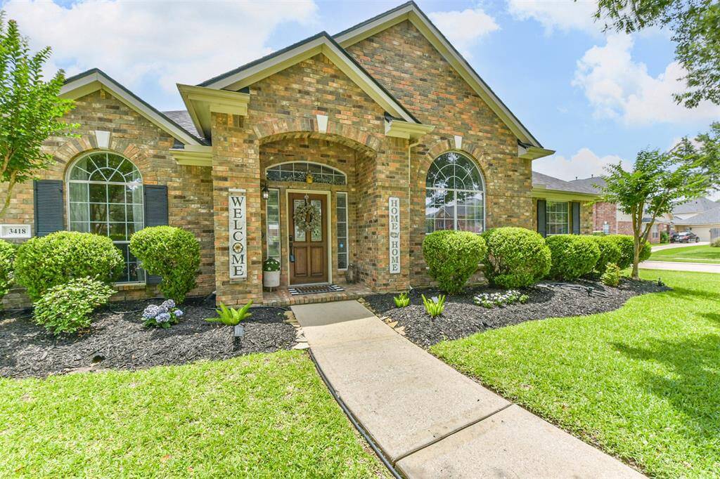 Brick on all sides with a covered entryway.