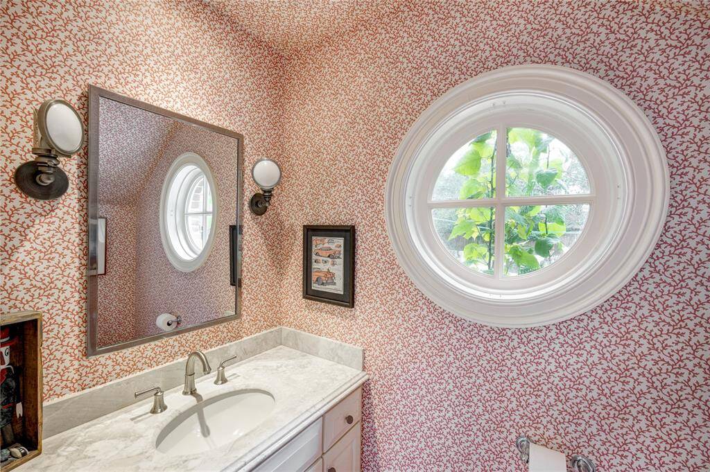 This lovely pool bathroom is conveniently located just off the back hallway.