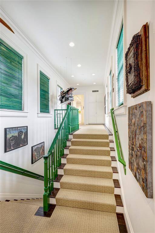 Off the kitchen, the backstairs lead you to the second-floor landing. From there, you can access the utility room, as well as the guest quarters and terrace.