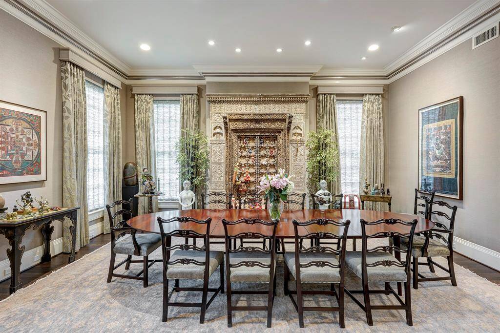 The expansive formal dining room, measuring 18 feet by 20 feet, is the perfect setting for unforgettable gatherings and large events. Transform your celebrations into extraordinary experiences in this beautifully designed space.