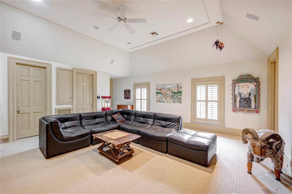 The gameroom, measuring 20 feet by 20 feet, is ideally suited for movie nights or social gatherings with friends. This space is designed to offer privacy from the main residence and can be accessed via the main house or an alternative back staircase.
