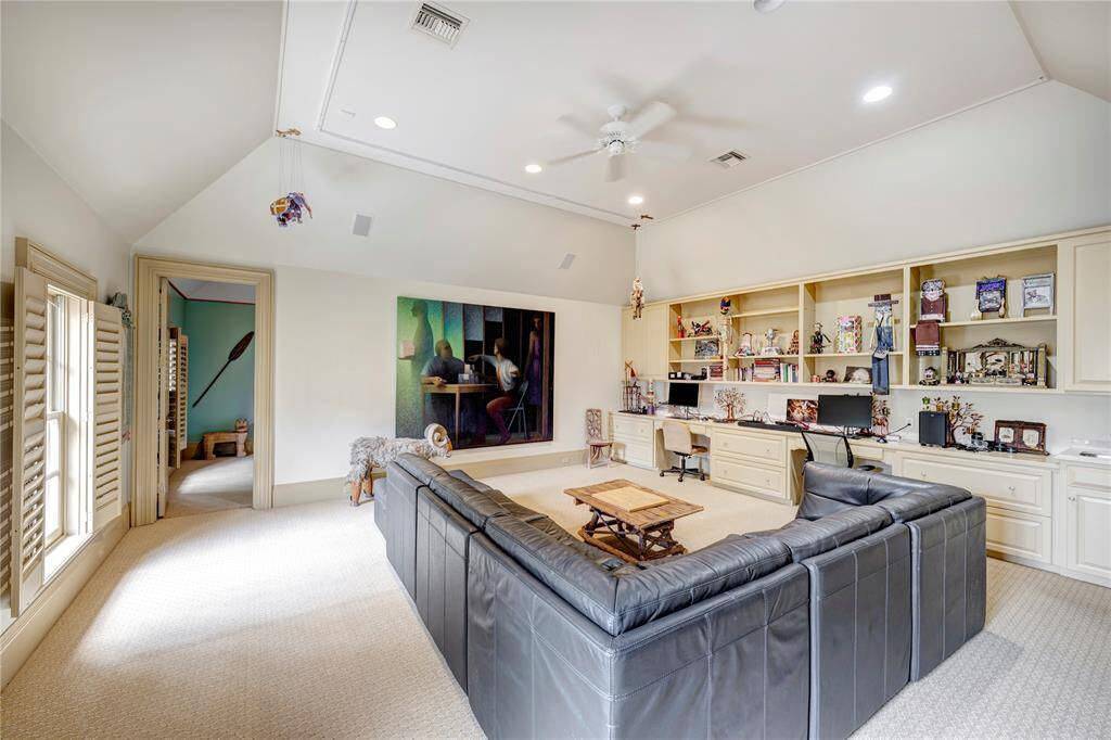 The gameroom in the back wing of the house has a full bathroom, guest bedroom 5, a wet bar with a mini-refrigerator, and a study nook.
