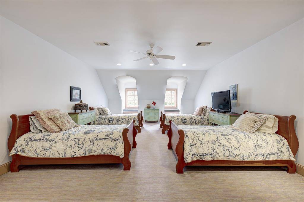 On the third floor, bedroom six features a full bath with a tub/shower, along with three walk-in attic accesses. There are also two locked storage closets, a media closet, and an ideal sleepover room.