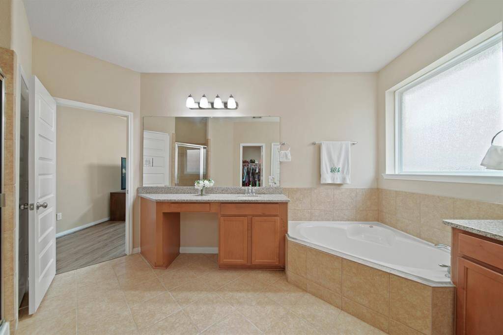 Separate vanity and garden tub and shower