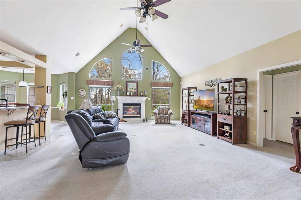 Front entry opens to living area and a wall of windows...