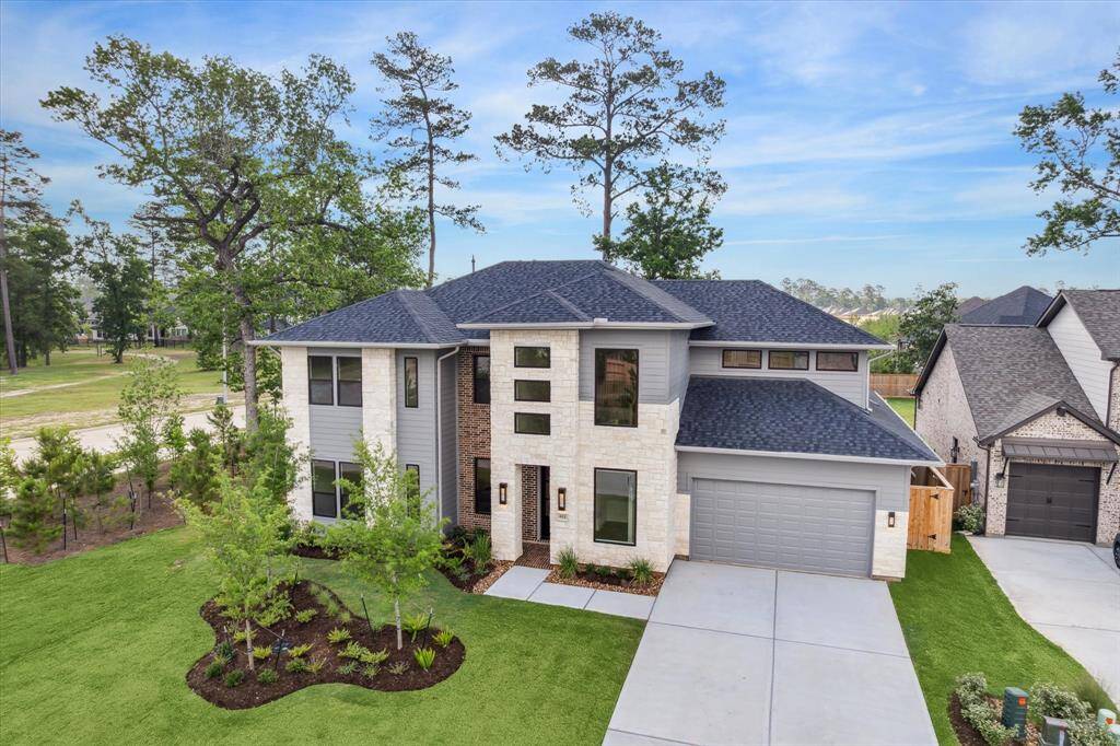 NEW CONSTRUCTION by award-winning Jamestown Estate Homes. 5 BR/4.1 BA, 3-Car Tandem Garage, modern-influenced home located in the sought-after Grand Central Park community in Conroe