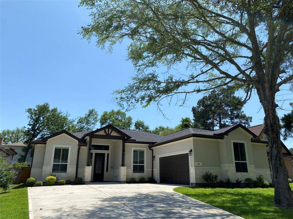 Stucco and stone modern craftsman on quiet cul-de-sac surrounded by mature trees. Double wide driveway accommodate 6 cars.