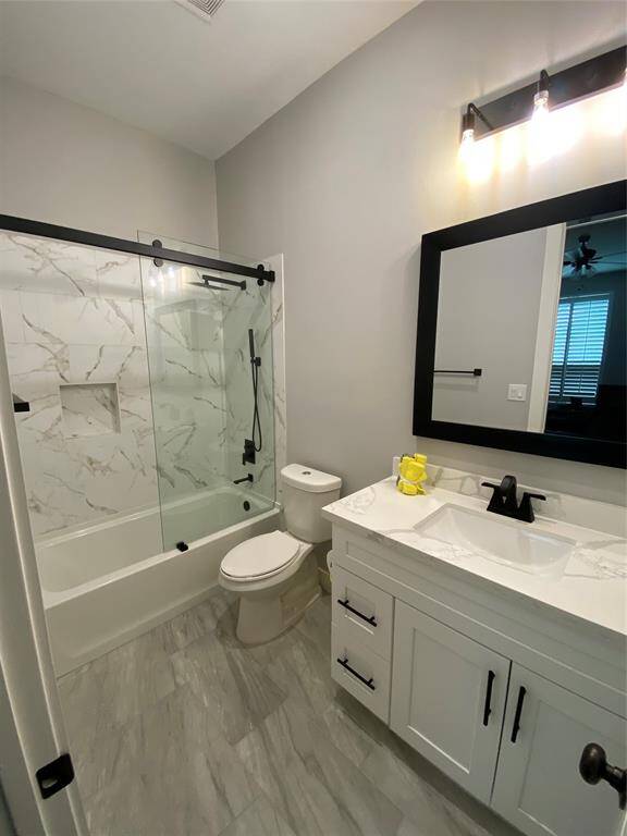 En-suite bathroom #3 offers a shower-tub combo featuring a rain shower head, hand held sprayer and a rolling style partition