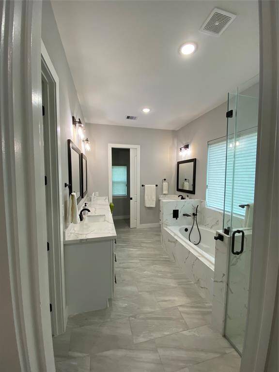 HER vanity is 8' long and features a sitting area for makeup. Vanity lights are programmable for color. Huge water closet separated by pocket door.