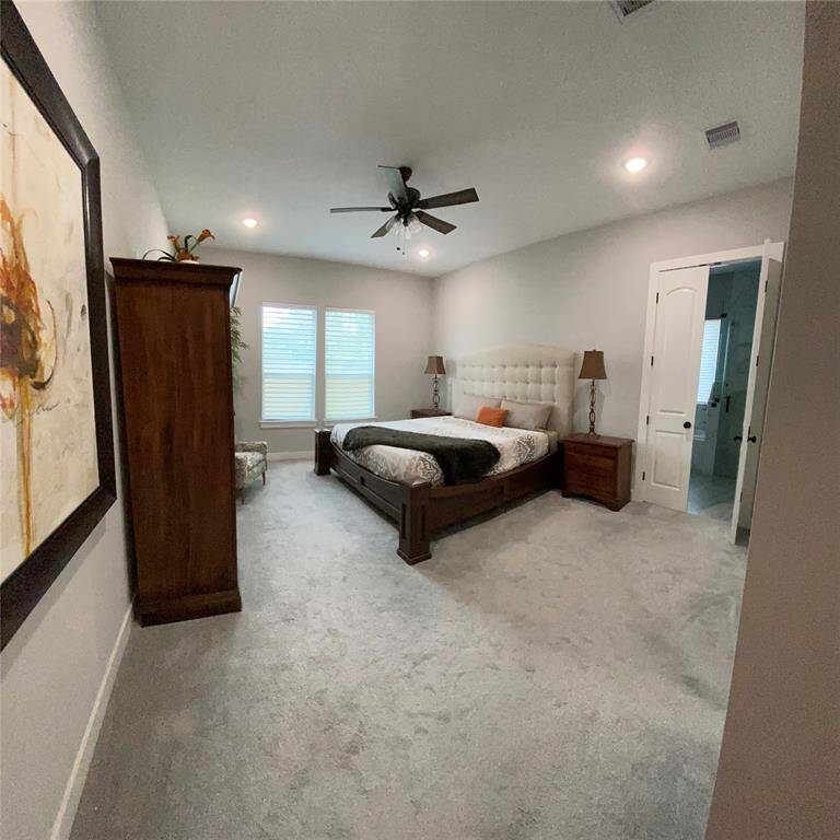 Primary Suite offers alcove entry for privacy and programmable sheer shades ready for your wake up call