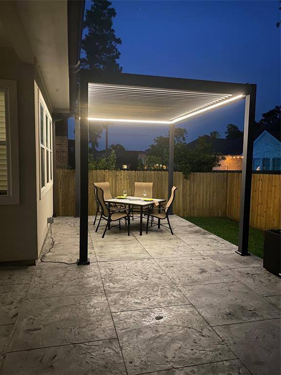 Remote controlled pergola to control the level of opening and lighting. Table remains