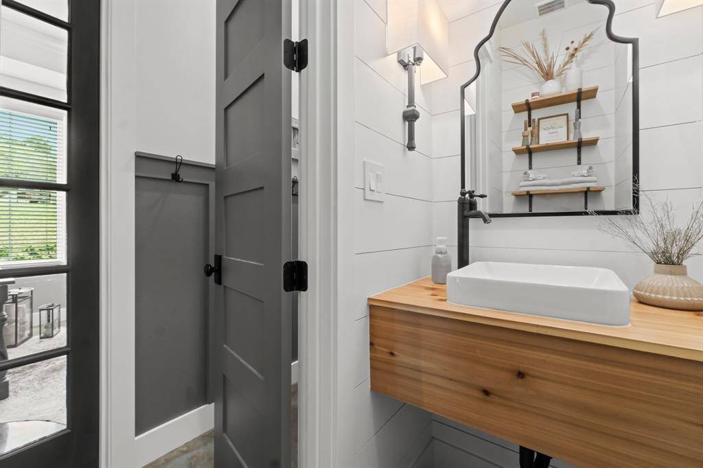 half bathroom just across from the office and utility room!