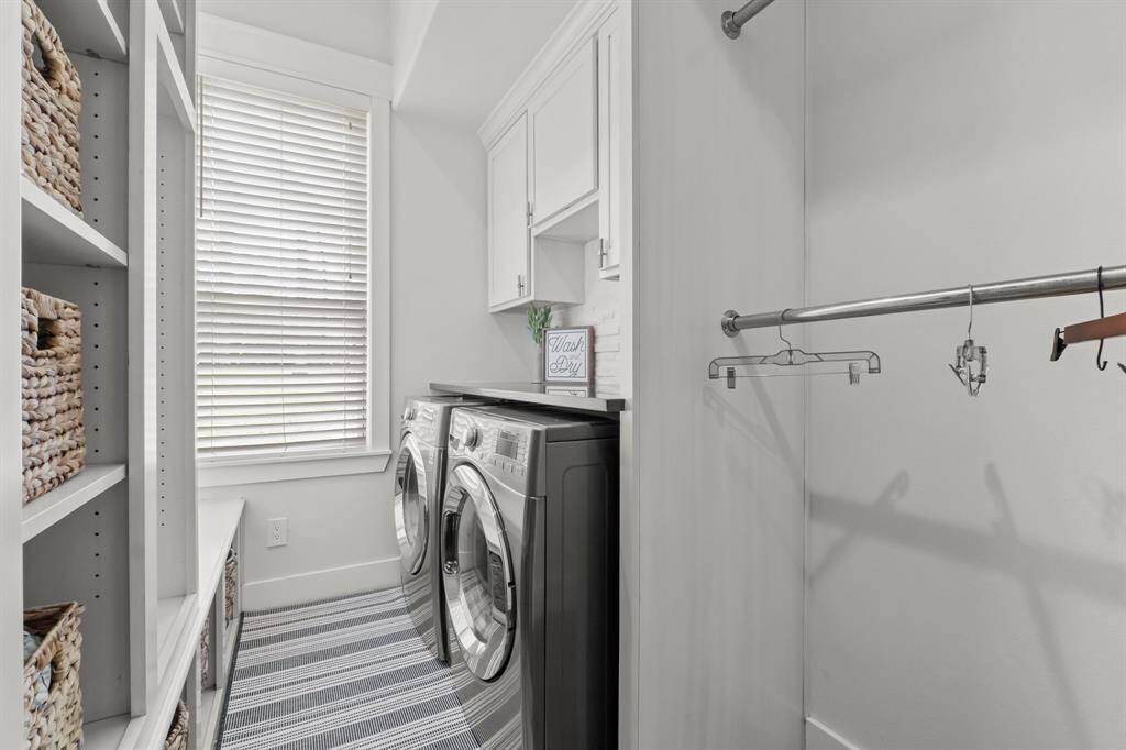 utility room features folding table and additional storage!