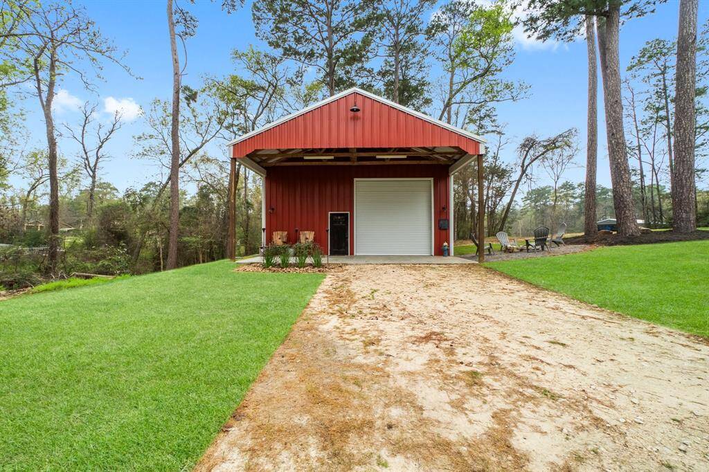 shop with covered porch and three roll up doors!