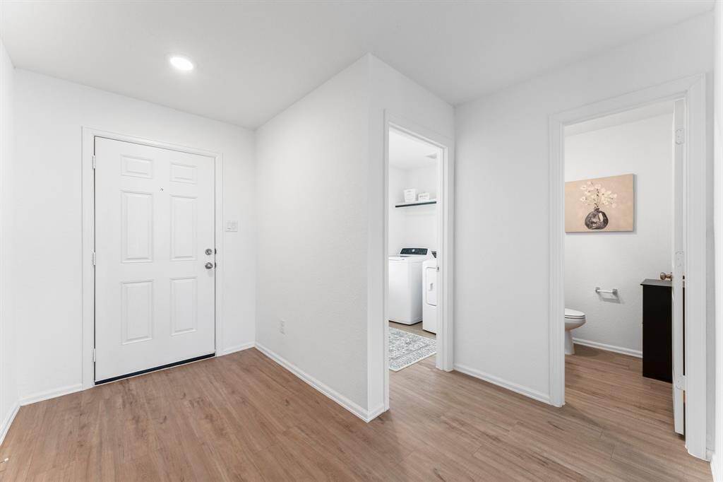 The powder bath and utility room are conveniently located off the main foyer!