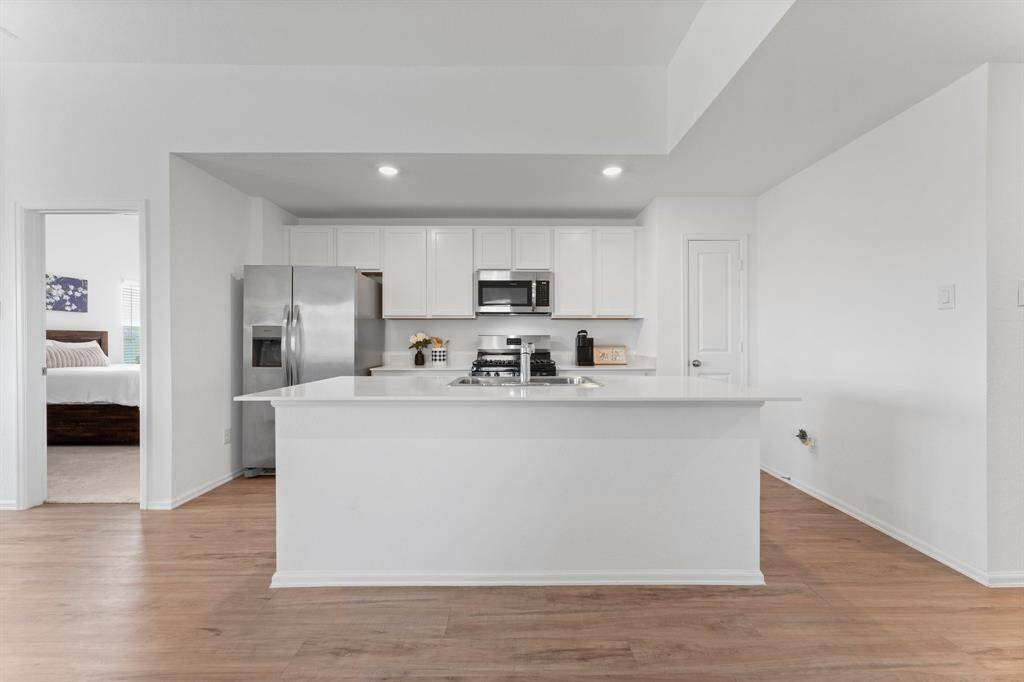 The beautiful white cabinets and white countertops are elegant and timeless!