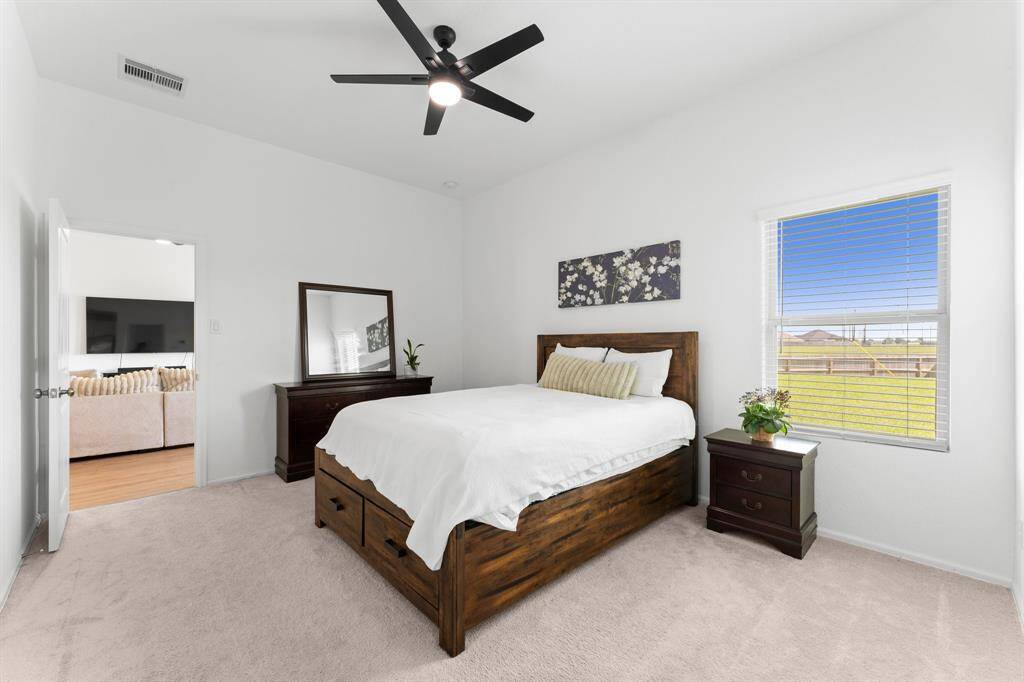 Another view of the primary suite, the oversized windows lets in nice natural light!