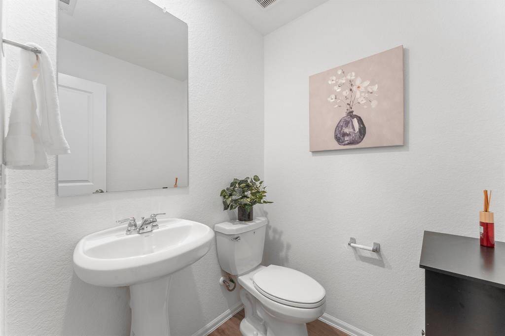 The powder bathroom features a nice pedestal sink!