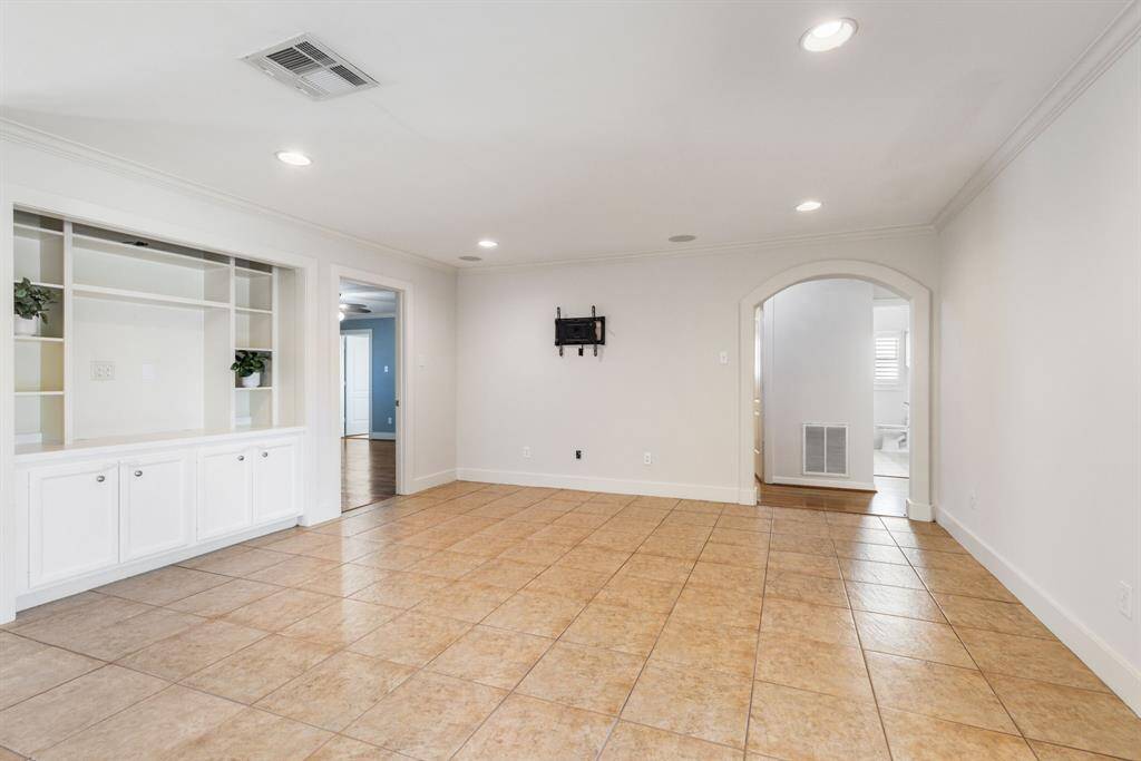 An alternate view of the living room, with access to the rest of the bedrooms located at this end of the house.