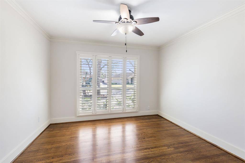 This dedicated office space offers a peaceful retreat for work, with the option to create a cozy reading nook where you can enjoy a book while taking in the views of the front yard.
