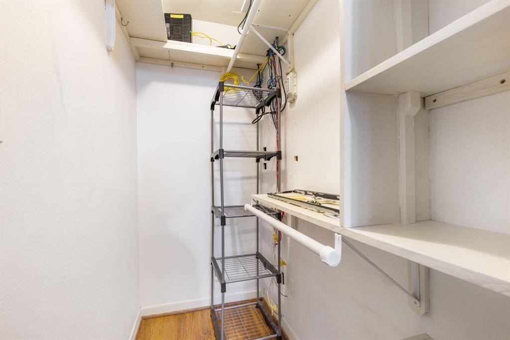 Second closet located in primary bedroom.  Holds electronics as well.