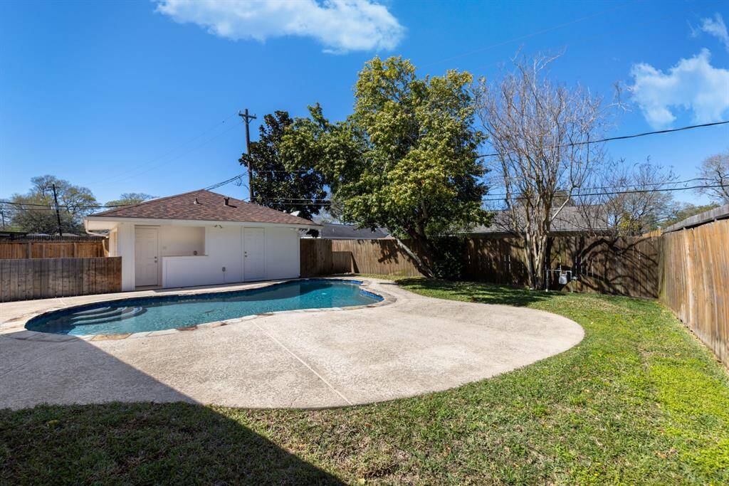 Notice the expansive decking surrounding the pool, ideal for creating an entertaining space for friends and family.