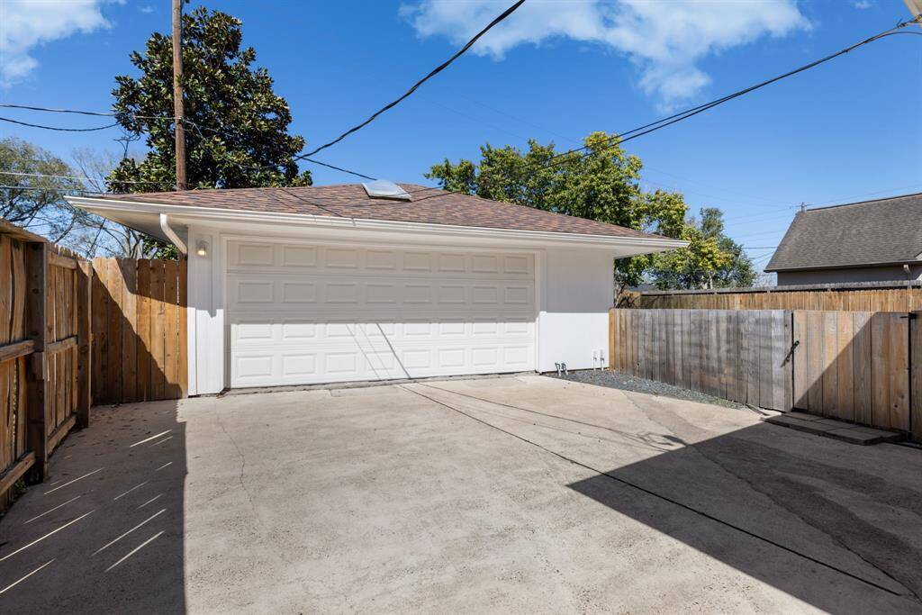 This two-car detached garage, located towards the back of the property, is slightly offset yet still conveniently close to the home.