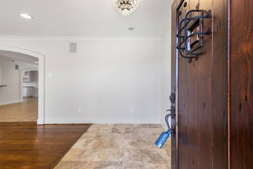 Enter the home through the beautifully refinished door, which opens to a great open-concept floor plan.