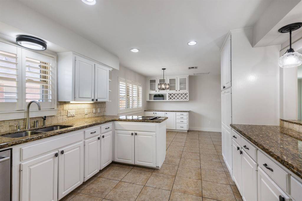 This kitchen was thoughtfully designed with an abundance of cabinet space, ensuring plenty of storage for all your needs.