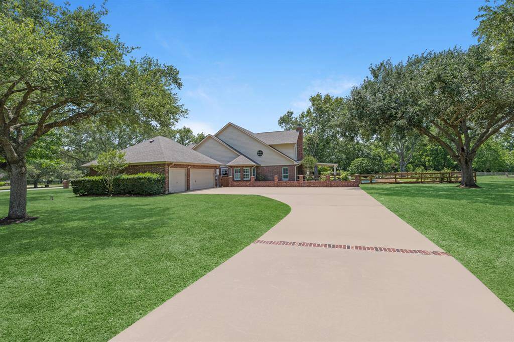A gorgeous extended driveway warmly welcomes you home, leading to a spacious three-car garage. The driveway is beautifully accented with a brick-lined center, adding charm and curb appeal.