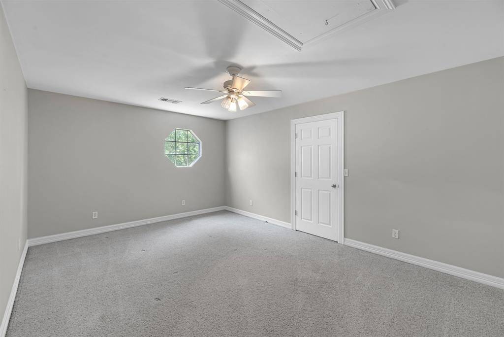 Also upstairs, this flexible space can serve as a fifth bedroom or a media room, featuring a massive storage closet to keep everything organized.
