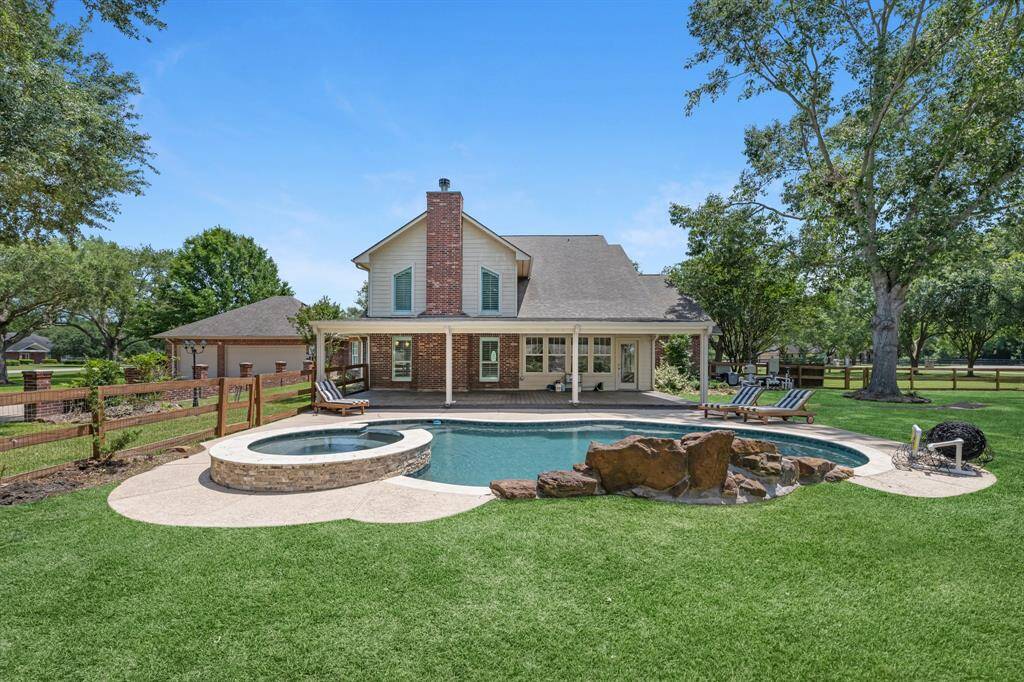This fenced section of the yard offers a safe space for pets and children, making it perfect for summer gatherings. Enjoy grilling, playing cornhole, and creating lasting memories in this spacious backyard—country living with city convenience.
